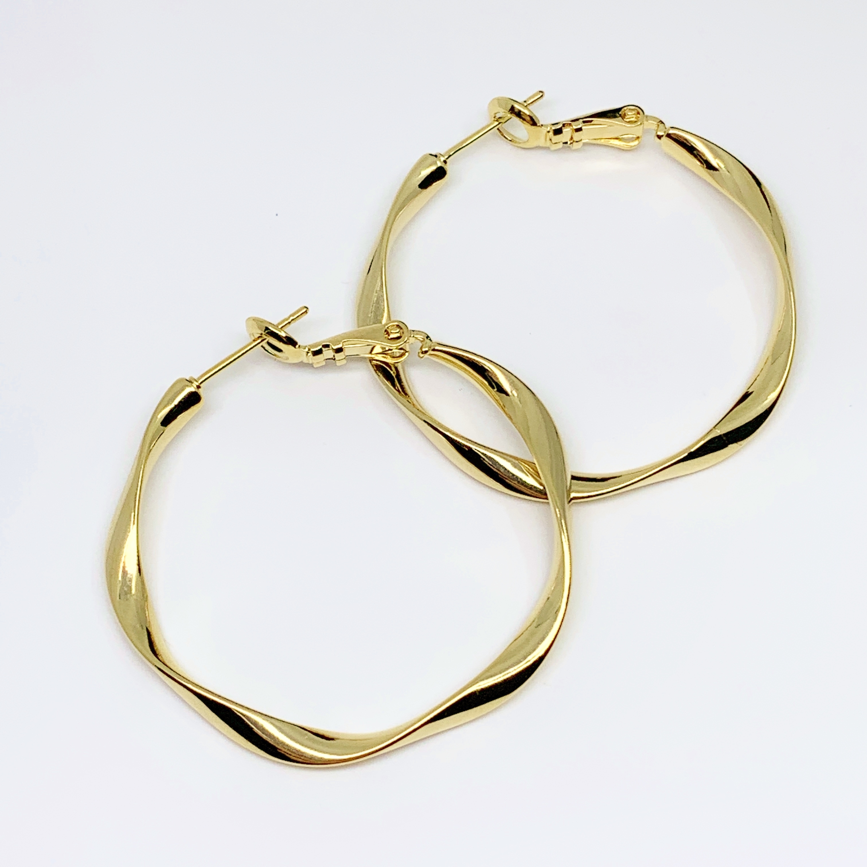 Wave hoop earrings sales